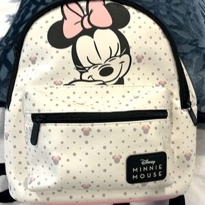 Disney Minnie Mouse Mini Backpack with Front Pocket with Zipper Closure.